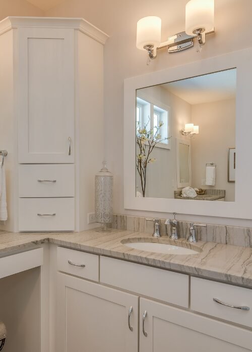 Bathroom remodel in Arlington, VA featuring a new vanity and make-up counter.